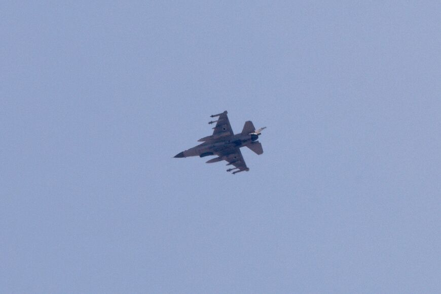 An Israeli air force F-16 Jet fighter aircraft flies over the border area between northern Israel and southern Lebanon