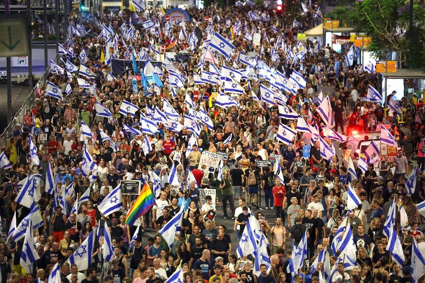 Relatives and supporters of Israelis taken hostage by Palestinian militants in Gaza in the October 7 attacks demonstrate for their release, in Tel Aviv on June 22, 2024