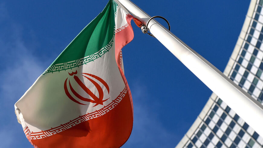The Iranian national flag is seen outside the International Atomic Energy Agency (IAEA) headquarters during the agency's Board of Governors meeting in Vienna on March 1, 2021. 