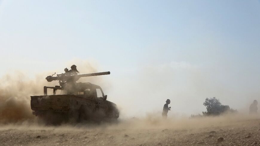 Saudi-backed government troops repel a Huthi rebel offensive on oil-rich Marib, east of Yemen's rebel-held capital Sanaa, in this file photo from February 14, 2021