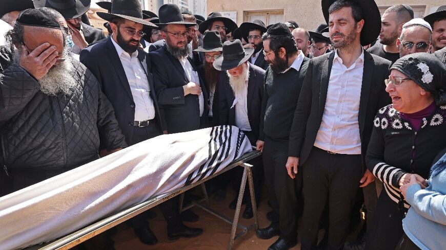 Israeli mourners attend the funeral of Avishai Yehezkel, one of five people killed in a shooting attack in the ultra-religious city of Bnei Brak