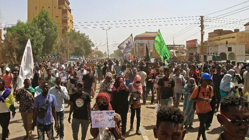 Sudanese rallied on International Women's Day in Khartoum on Tuesday, shouting slogans in support of women who had stood up autocratic government in the past, amid ongoing protests following a military coup