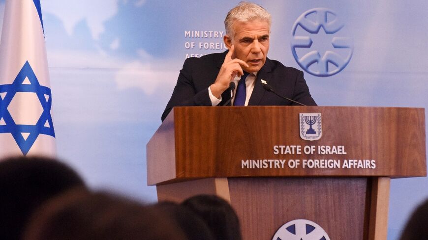 Israeli Foreign Minister Yair Lapid speaks during a press briefing on Sunday
