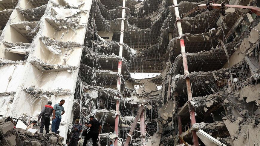 Iranians gather at the site where a 10-story building collapsed.