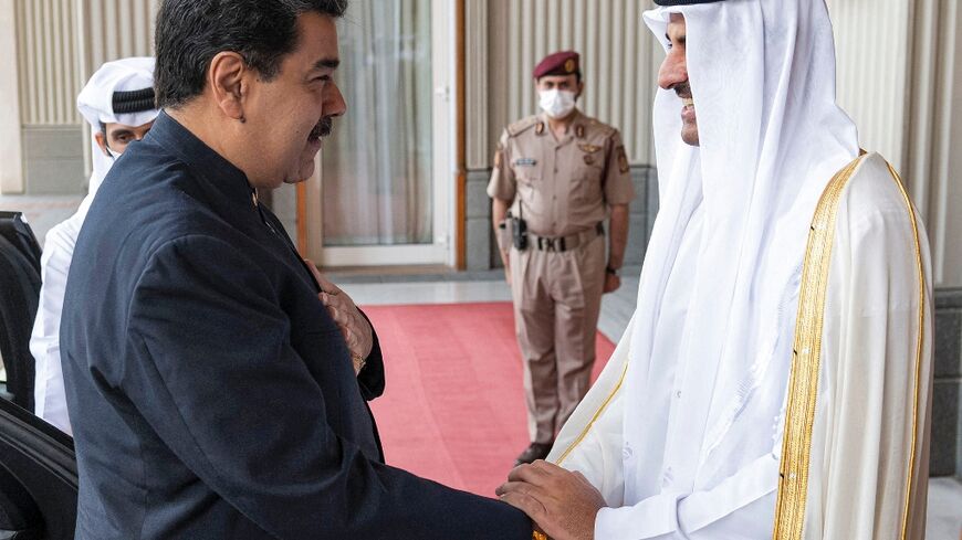 Qatar's Emir Sheikh Tamim bin Hamad Al-Thani (R) receives Venezuela's President Nicolas Maduro at the Royal Palace in Doha