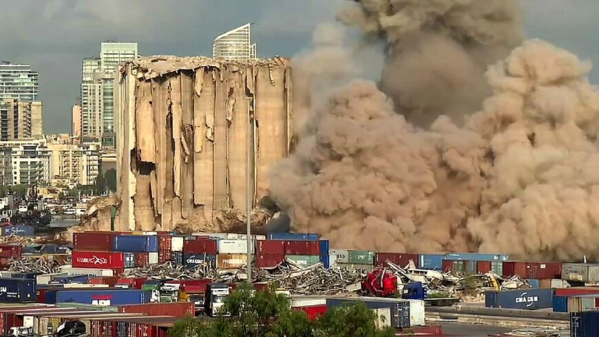 This grab from AFPTV footage shows a massive plume of smoke rising over Beirut port after the collapse of eight more grain silos damaged in a devastating 2020 explosion