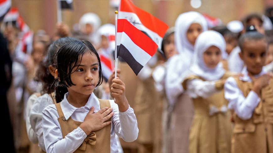 Children attend the first day of the new academic year at a school in Yemen's third city of Taez on August 8