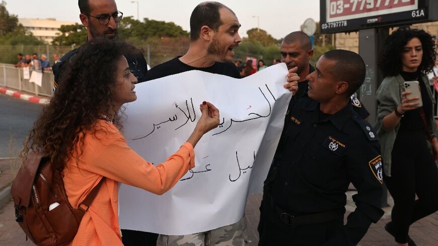 Police detain a protester outside the Shamir Medical Centre south of Tel Aviv on August 31, 2022, where Khalil Awawdeh is being held