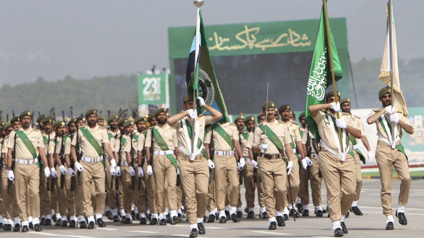 Saudi Arabia's army soldiers march during the Pakistan Day parade in Islamabad on March 23, 2022. 