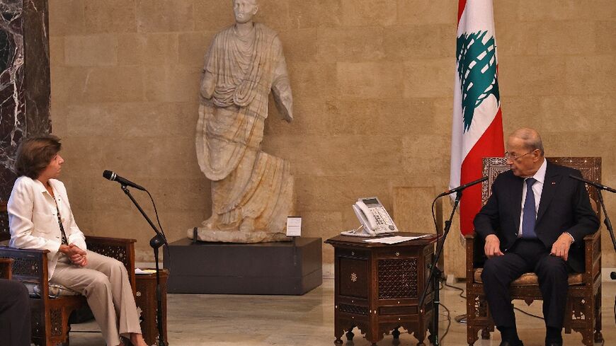 Lebanon's President Michel Aoun (R) meets with France's Foreign and European Affairs Minister Catherine Colonna in Baabda, east of the capital Beirut