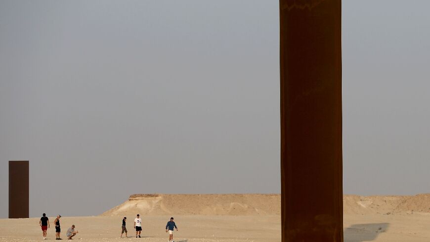 Two of the four steel slabs of US artist Richard Serra's "East-West/West-East" installation in the Qatari desert