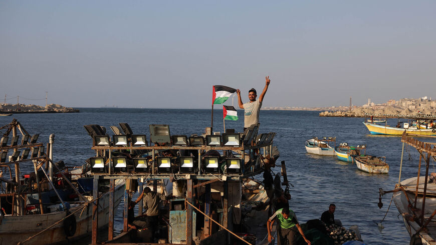 Palestinians participate in a rally at the Gaza City sea port, in which they demand their right to receive gas from maritime fields in the eastern Mediterranean and the lifting of the Israeli blockade, Gaza Strip, Sept. 13 2022.