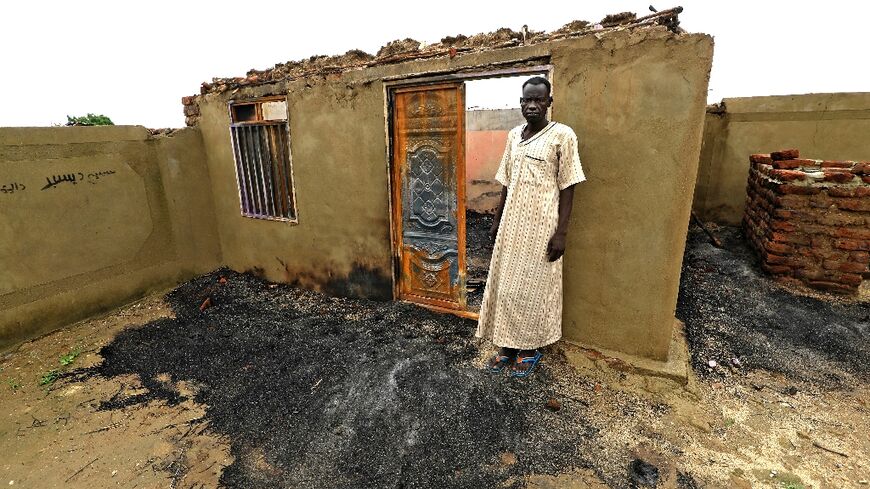 Sudan's Blue Nile state has seen repeated deadly unrest since July: this August 8 photograph shows home that was set on fire near Roseires