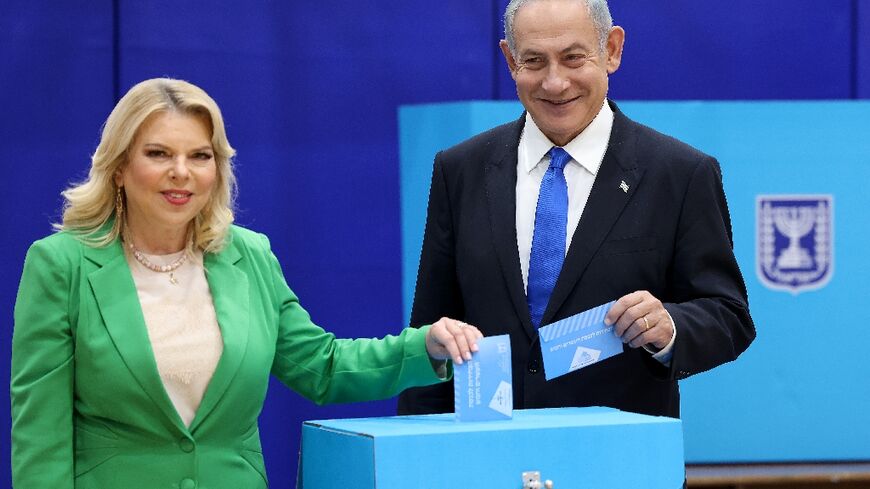 Likud leader Benjamin Netanyahu and his wife Sara cast their ballots
