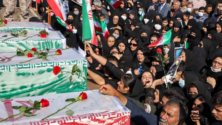 Iranians take part in a funeral in Izeh, a city in the country's southwest