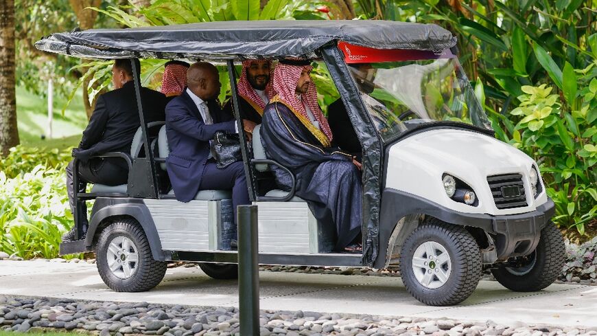 Saudi Arabia's Crown Prince Mohammed bin Salman rides a buggy during the G20 leaders' summit in Bali