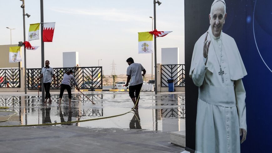 Workers clean up outside the cathedral of Our Lady of Arabia, near the Bahraini capital Manama, ahead of the pope's visit