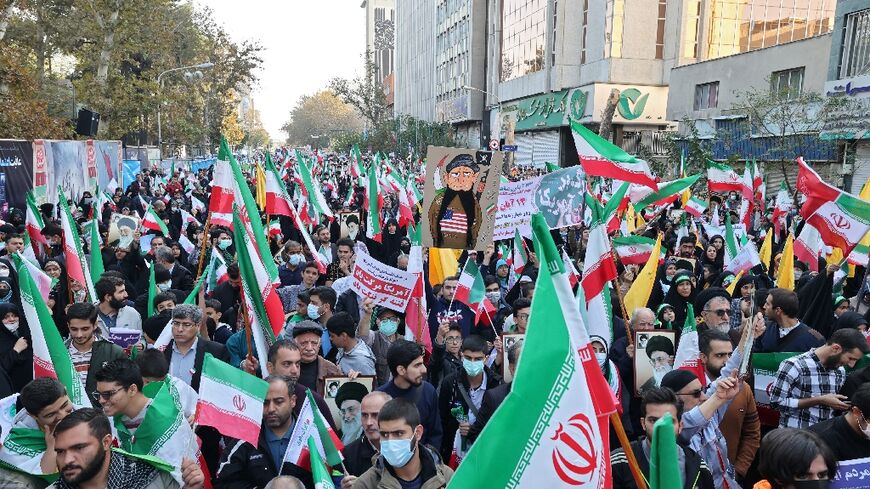 Iranians rally outside the former US embassy in Tehran to mark 43 years since supporters of the Islamic revolution took 50 embassy staff hostage