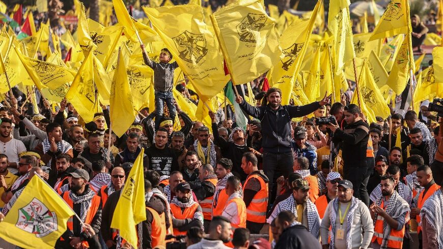 Fatah supporters wave their movement's yellow colours at a rare mass rally in the Hamas-controlled Gaza Strip