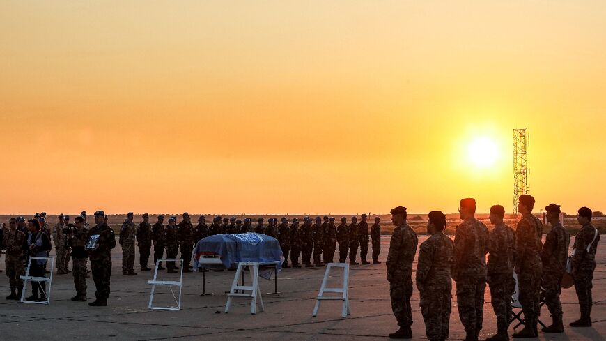 Peacekeepers of the United Nations Interim Force in Lebanon (UNIFIL) attend the repatriation ceremony for Irish Private Sean Rooney 