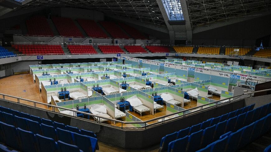 Patient beds in Beijing stadium. China could see over 1 mn Covid deaths in 2023