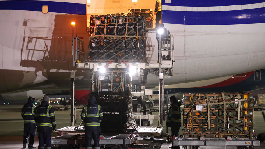 Ground crew unload weapons and other military hardware delivered by the US military at Boryspil International Airport, Boryspil, Ukraine, Jan. 25, 2022.
