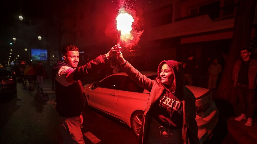 Keeping the flame alive -- Moroccans remained upbeat in the capital Rabat after the national team's defeat to France, much like the nation's press 