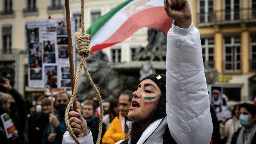 A protester holds a gallows rope during a rally in the French city of Lyon on January 8 against the Iranian regime