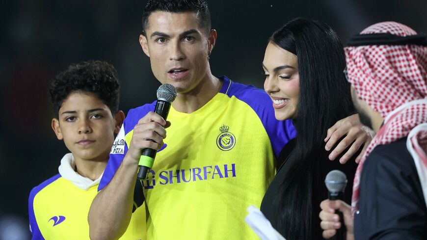 Portuguese forward Cristiano Ronaldo (C) will make his Saudi Pro League debut on Sunday