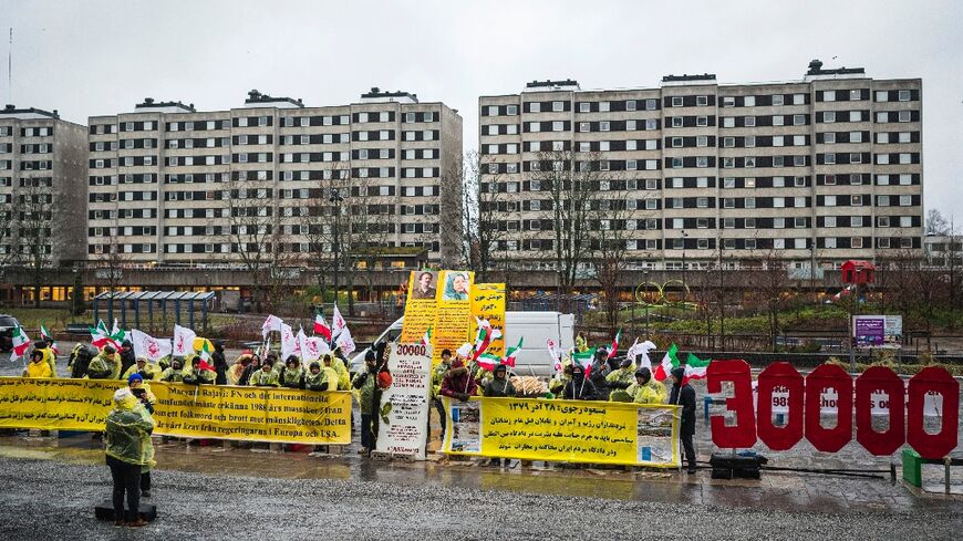 Protesters opposed the regime in Iran gathered outside the Stockholm courthouse as appeal trial opened