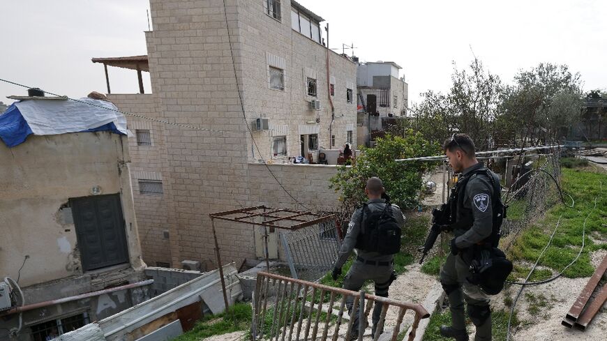 Israeli soldiers arrive at the east Jerusalem family home of Khayri Alqam, who killed seven people outside a Jewish settlement synagogue