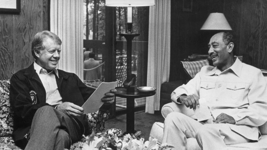 17th September 1978: U.S. president Jimmy (James Earl) Carter (left) and Egyptian president Anwar al-Sadat (1918-1981), sitting in Dogwood Lodge during a break in the Egypt - Israel peace agreements, at Camp David, Maryland. (Photo by Hulton Archive/Getty Images)