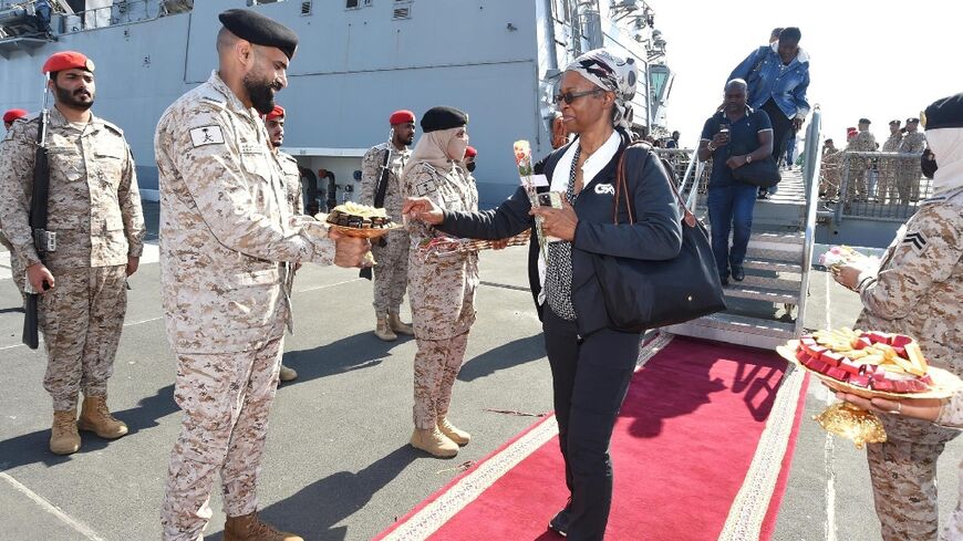 Civilians evacuated from Sudan arrive at the Saudi port of Jeddah in the first such rescue operation since violence erupted there a week ago