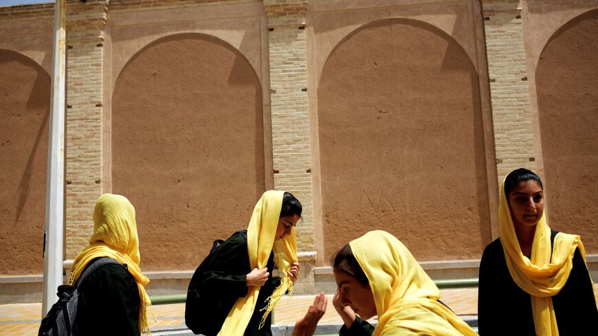 Iranian Armenian schoolgirls walk home after class in the Julfa neighbourhood in the historic city of Isfahan, some 400 kms south of the capital, Tehran on April 21, 2015. Julfa neighborhood in Isfahan is where the biggest Armenian community in Iran resides and was established as an Armenian quarter by Persian Safavid King Shah Abbas I in 1606. Some 180.000 Armenians were living in Iran before the Islamic revolution in 1979, compared to some 60000 today, according to official figures. Most of the community 