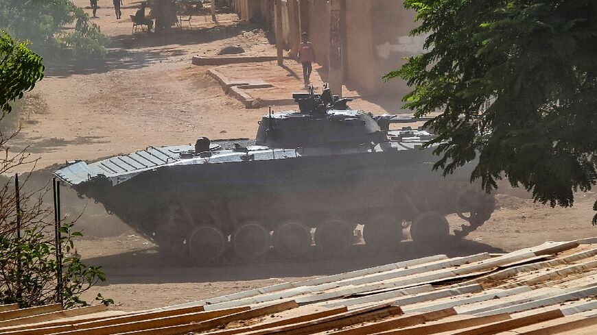 A Sudanese army armoured vehicle is stationed in southern Khartoum, after the latest ceasefire announcement