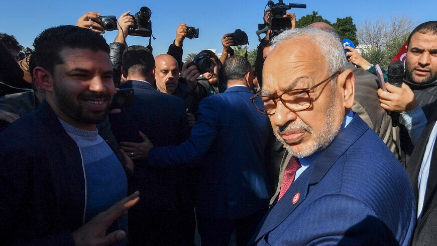 Rached Ghannouchi arrives at a police station in Tunis on February 21, 2023
