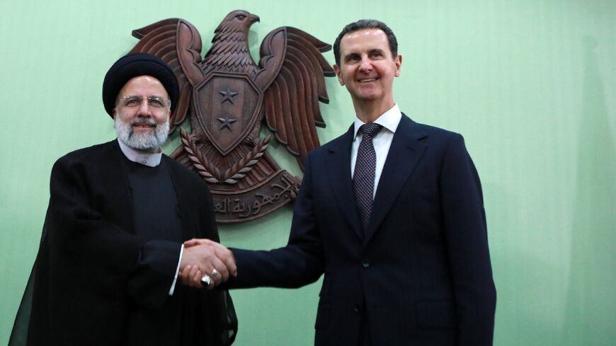 Syria's President Bashar al-Assad, on the right, with his Iranian counterpart Ebrahim Raisi in Damascus on May 3, 2023