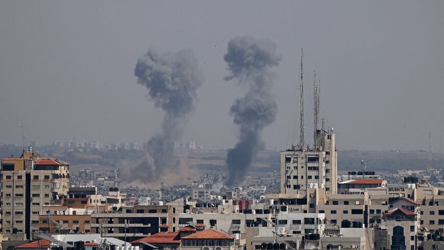 Smoke billows following Israeli strikes on Gaza City on May 10, 2023