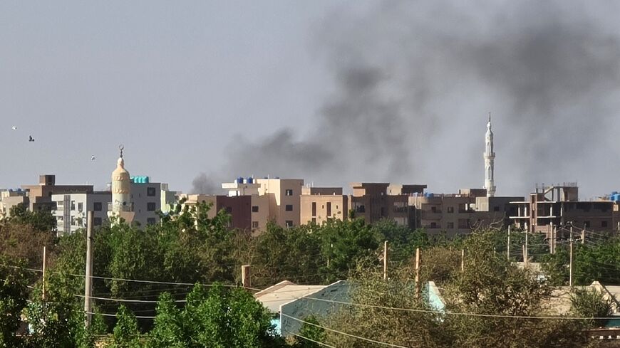 Smoke billows in Khartoum amid ongoing fighting between the forces of two rival generals