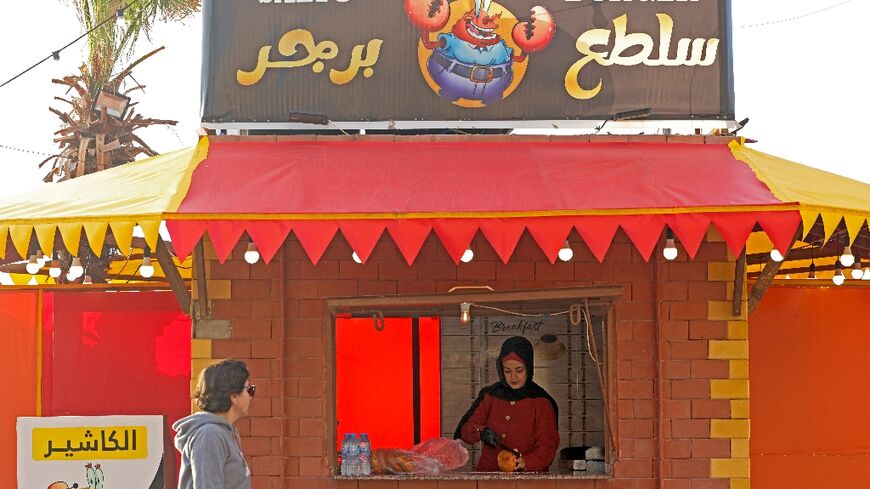 Unable to find work, Amani Shaath opened her own Gaza seafront kiosk to sell hamburgers