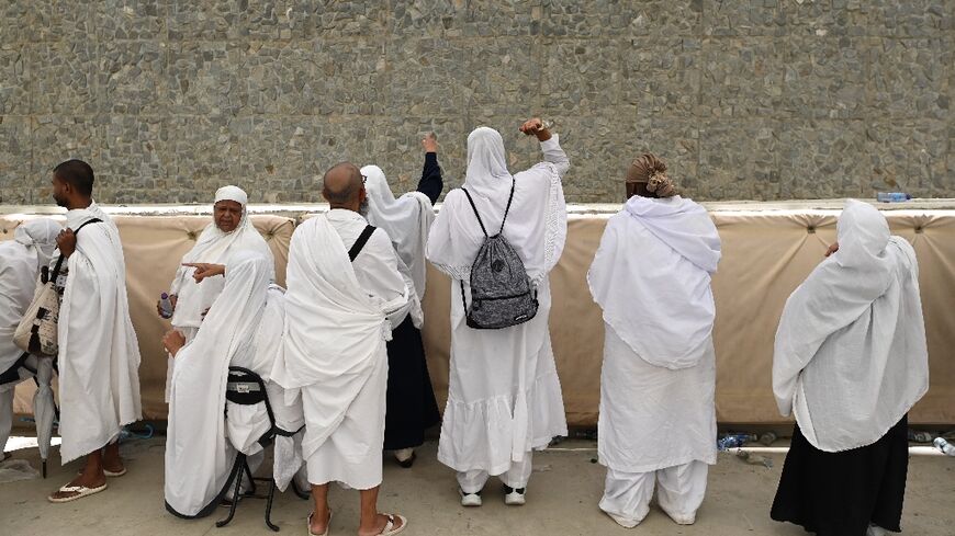 Pilgrims perform the "stoning of the devil" ritual as the 2023 hajj draws to a close in Saudi Arabia