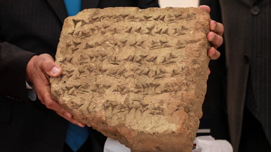 The 2,800-year-old stone tablet returned to Iraq contains text in cuneiform, the Babylonian alphabet