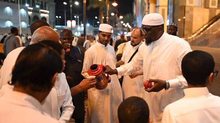 A Saudi family distributes free tea to pilgrims in Mecca for the hajj pilgrimage