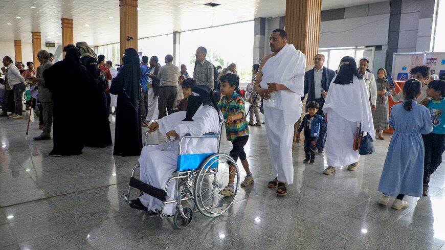 Yemeni hajj pilgrims wait at the Sanaa International Airport to board a plane for Saudi Arabia