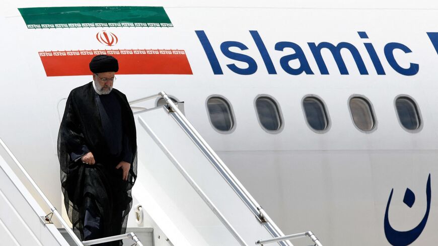 Iranian President Ebrahim Raisi disembarks after landing at Simon Bolivar International Airport in Maquetia, La Guaira State, Venezuela, on June 12, 2023.