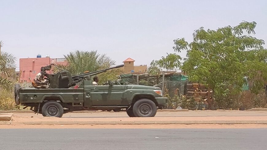 Fighters of the paramilitary Rapid Support Forces (RSF) drive an armoured vehicle in southern Khartoum, on May 25, 2023