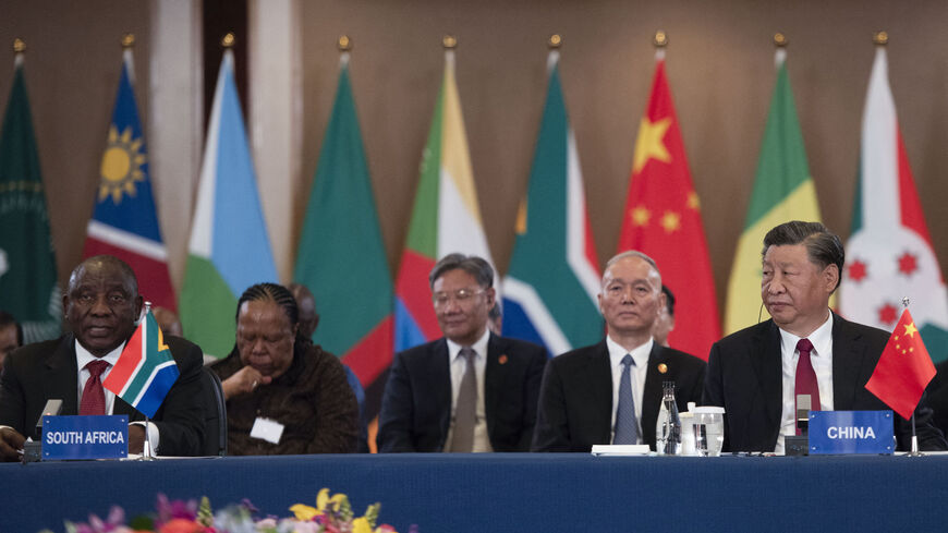 President of China Xi Jinping (R) and South African President Cyril Ramaphosa (L) attend the China-Africa Leaders' Roundtable Dialogue on the last day of the 2023 BRICS Summit in Johannesburg on August 24, 2023. (Photo by ALET PRETORIUS / POOL / AFP) (Photo by ALET PRETORIUS/POOL/AFP via Getty Images)