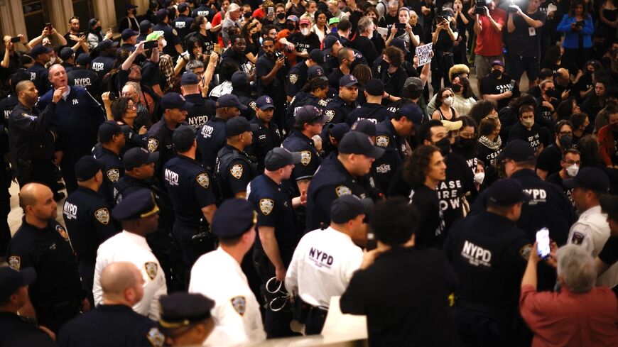 NYPD officers move in on a sit-in organised by Jewish groups calling for a ceasefire in the Israel-Hamas war, at Grand Central station in New York City