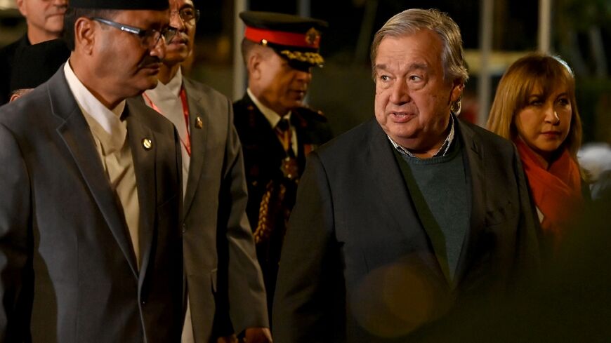 United Nations Secretary General Antonio Guterres (R) walks with Nepal's Foreign Minister Narayan Prakash Saud 