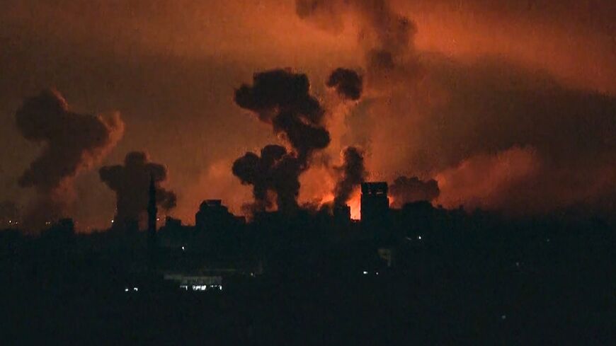 Fire and smoke rise over Gaza City as Israel unleashes one of its fiercest bombardments in three weeks of war with Hamas
